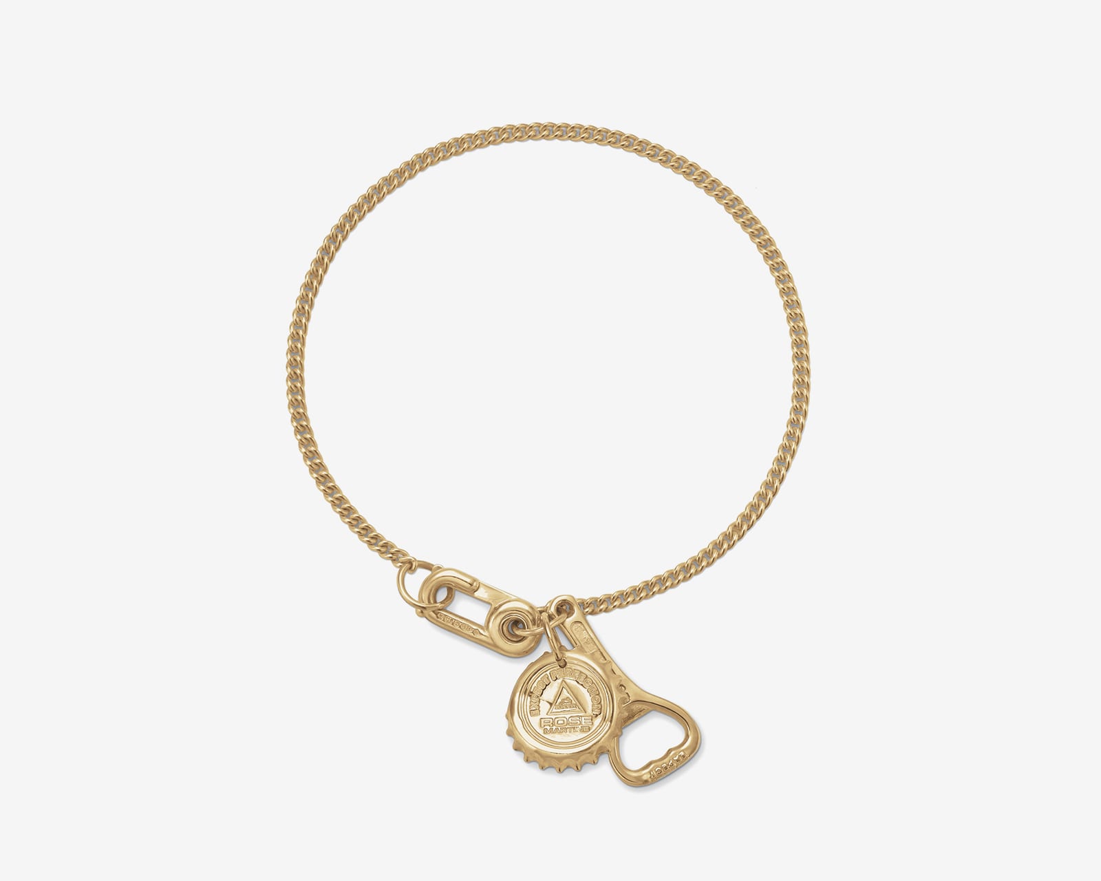 A fine yellow gold curb chain bracelet with a hook clasp, hung with a miniature gold bottle cap and a small bottle opener