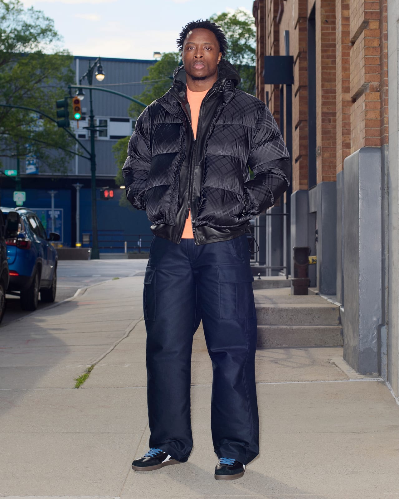 OG Anunoby in Burberry's black puffer jacket on a New York street, one of the 170 portraits in Burberry's 170: The Anniversary Portraits campaign