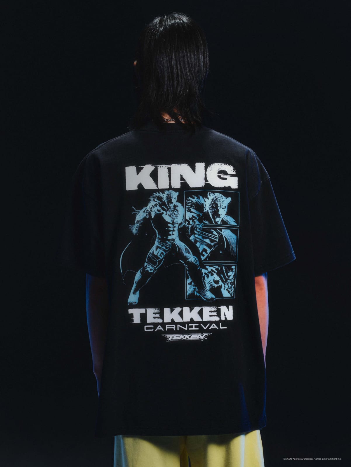 The back of the black Carnival x Tekken KING tee, with KING above a blue panel of the character and TEKKEN CARNIVAL below
