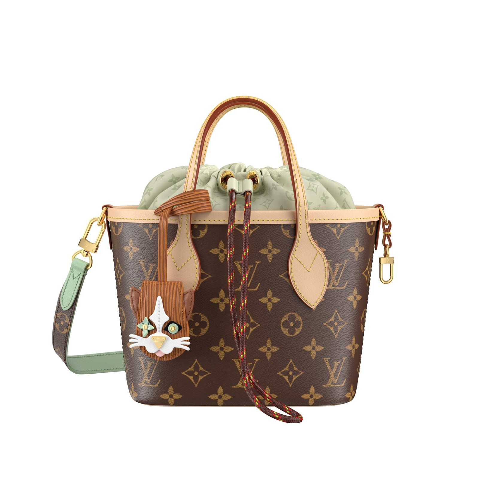 A small Louis Vuitton Neverfull BB tote in brown Monogram canvas with a pale green Monogram drawstring pouch at the top, a braided rope drawcord, a mint green and Monogram shoulder strap, and a brown cat-face charm with white whiskers hanging from one handle
