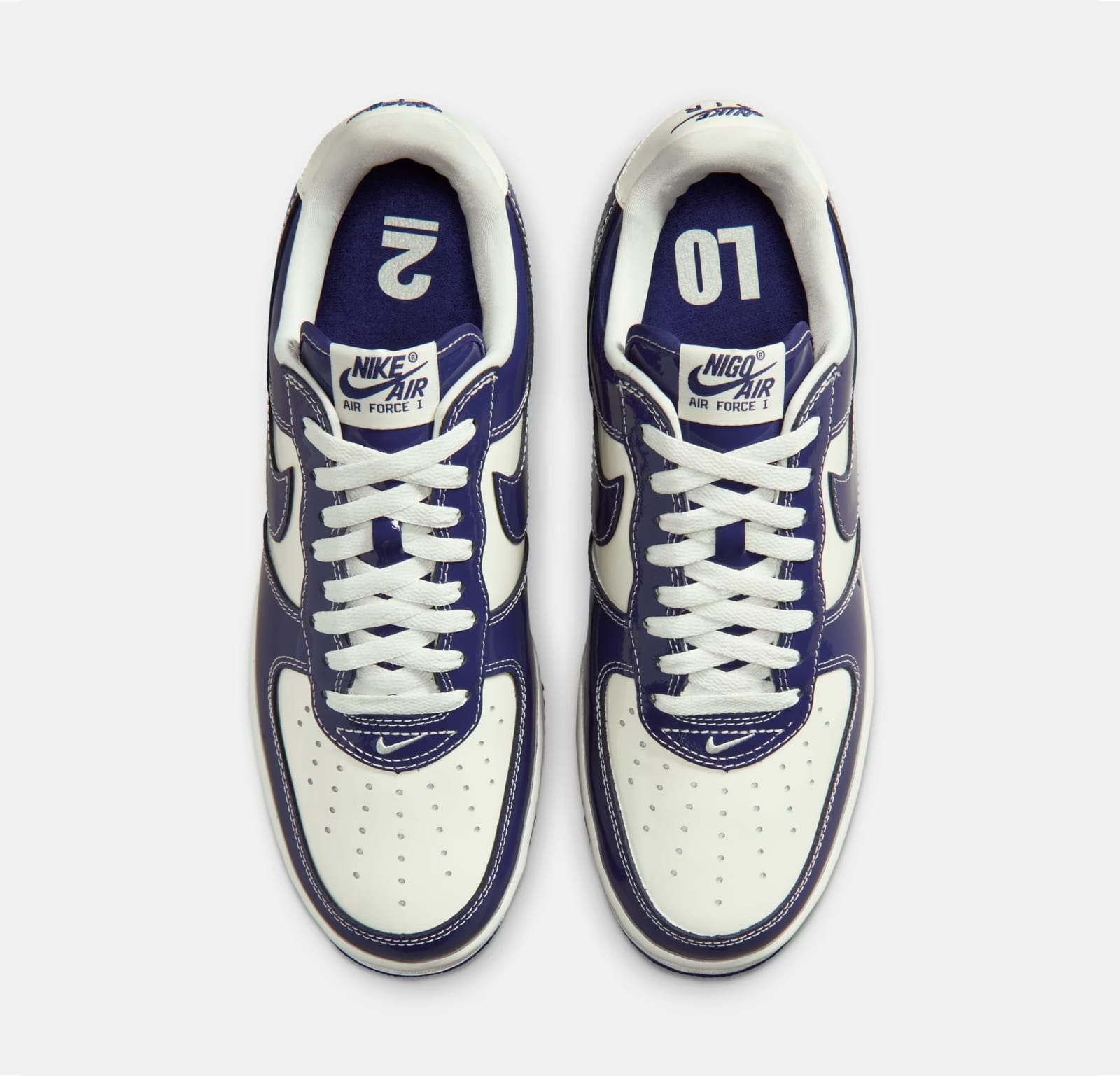 The Nike x NIGO Air Force 1 "LO2" from above: navy patent leather over sail, with "LO" and "2" on the insoles and NIGO Air tongue labels