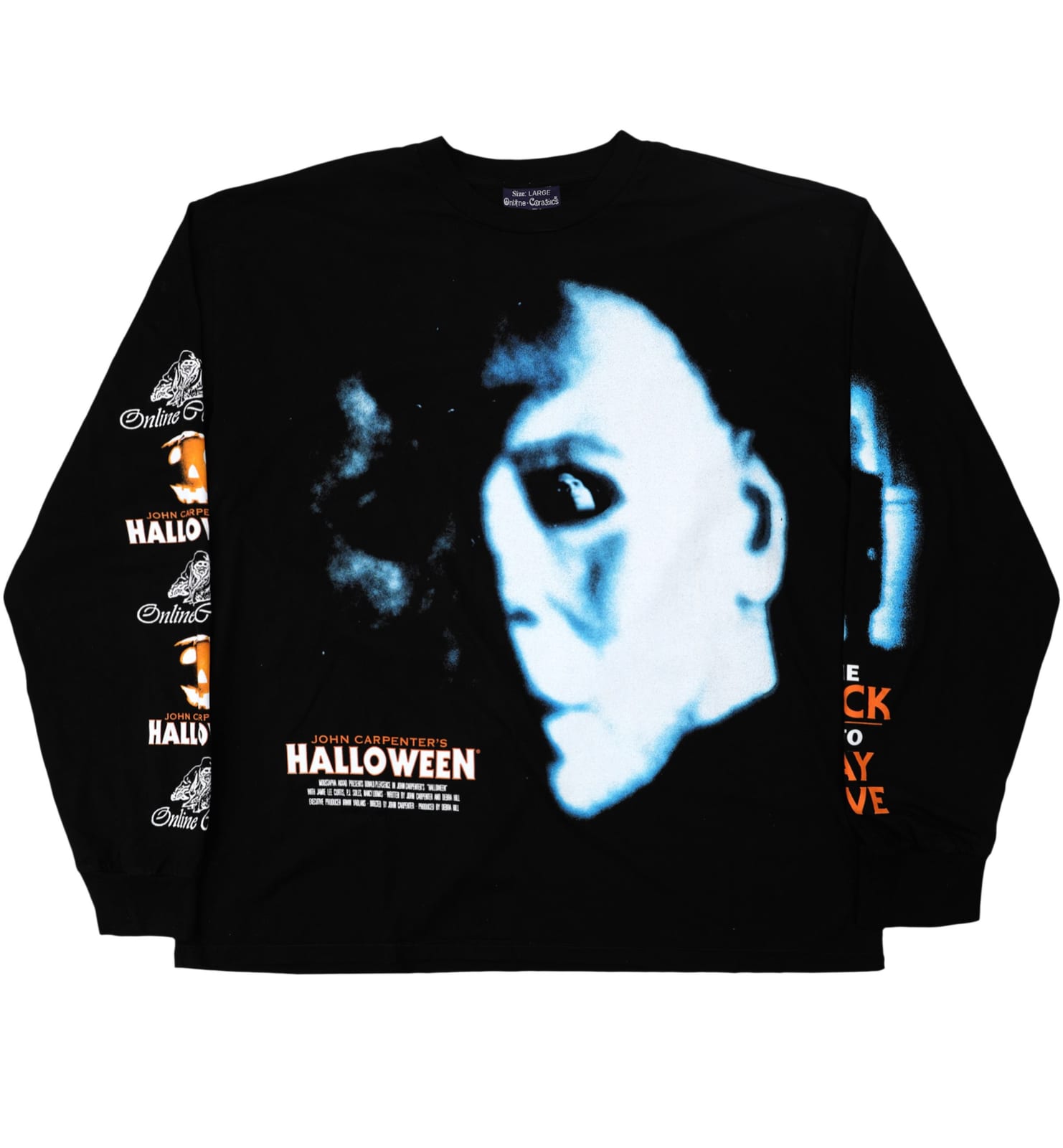 A black long-sleeve tee printed with a large blue-lit photo of Michael Myers' mask, the John Carpenter's Halloween title in orange and white below it, and Online Ceramics and Halloween graphics running down one sleeve