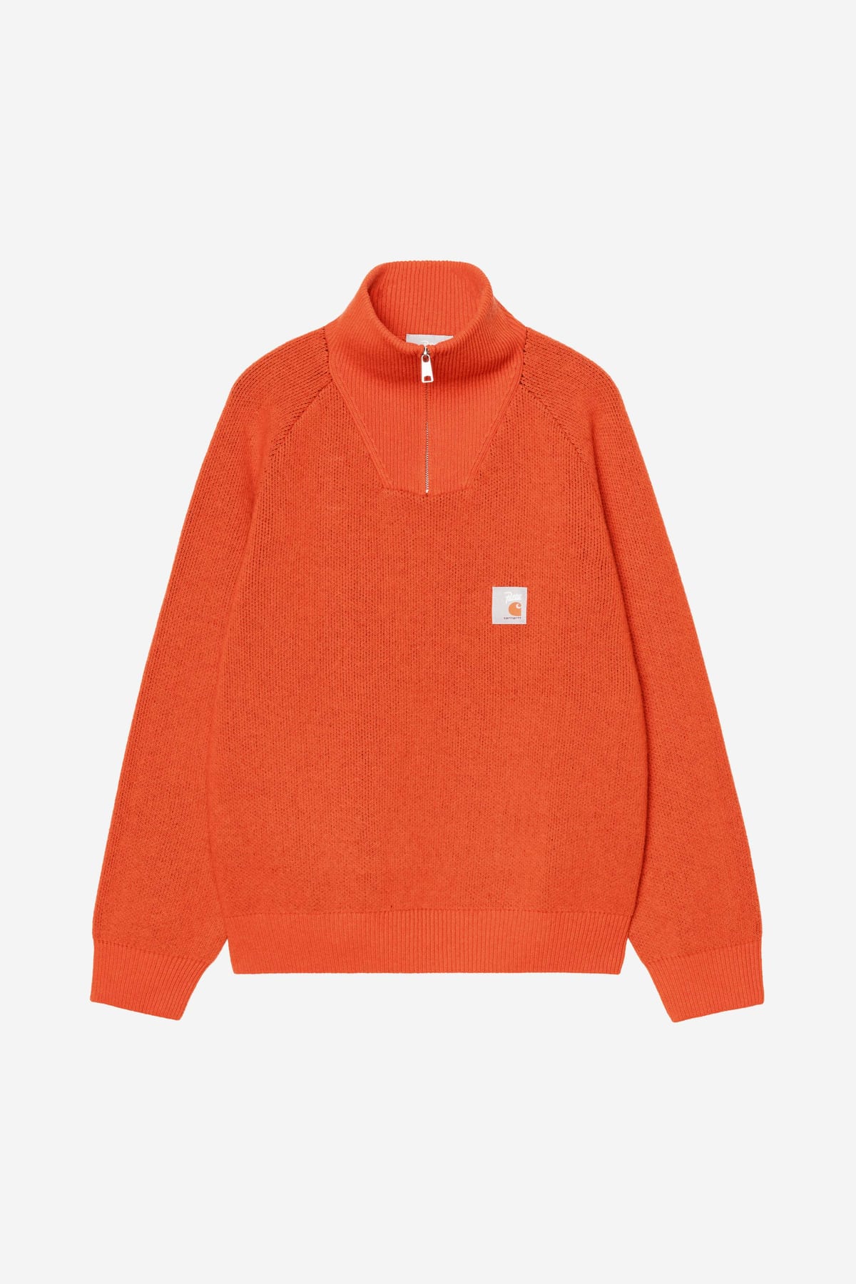 The Patta x Carhartt WIP Half Zip Sweater in bright safety orange knit with a small square label on the chest