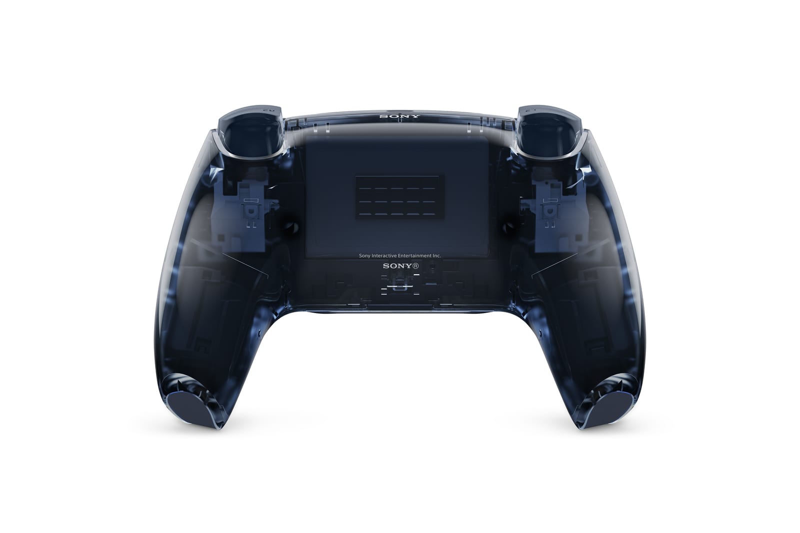The back of a smoky translucent grey-blue DualSense controller on white, with the internal frame, battery cover and trigger mechanisms visible through the clear shell and SONY printed at the top and bottom