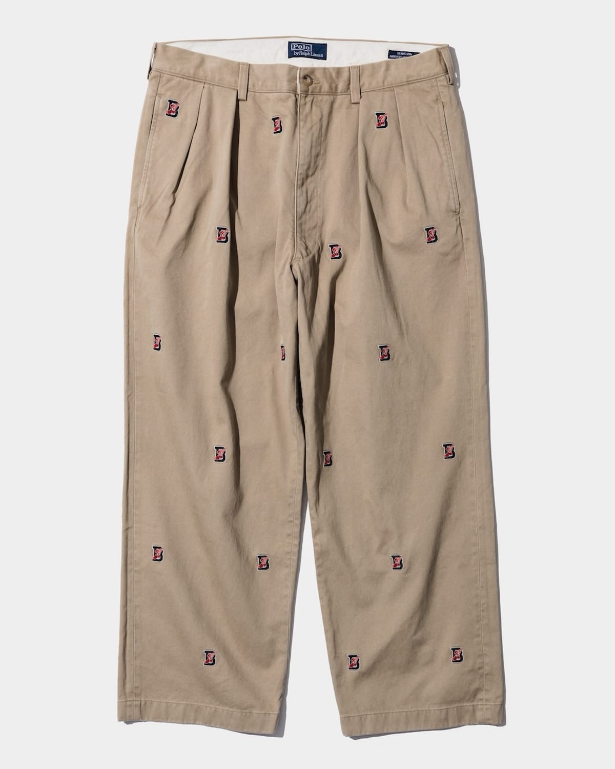 Polo Ralph Lauren for BEAMS B-WING Andrews pants in khaki, pleated and wide, scattered with small B-WING emblems