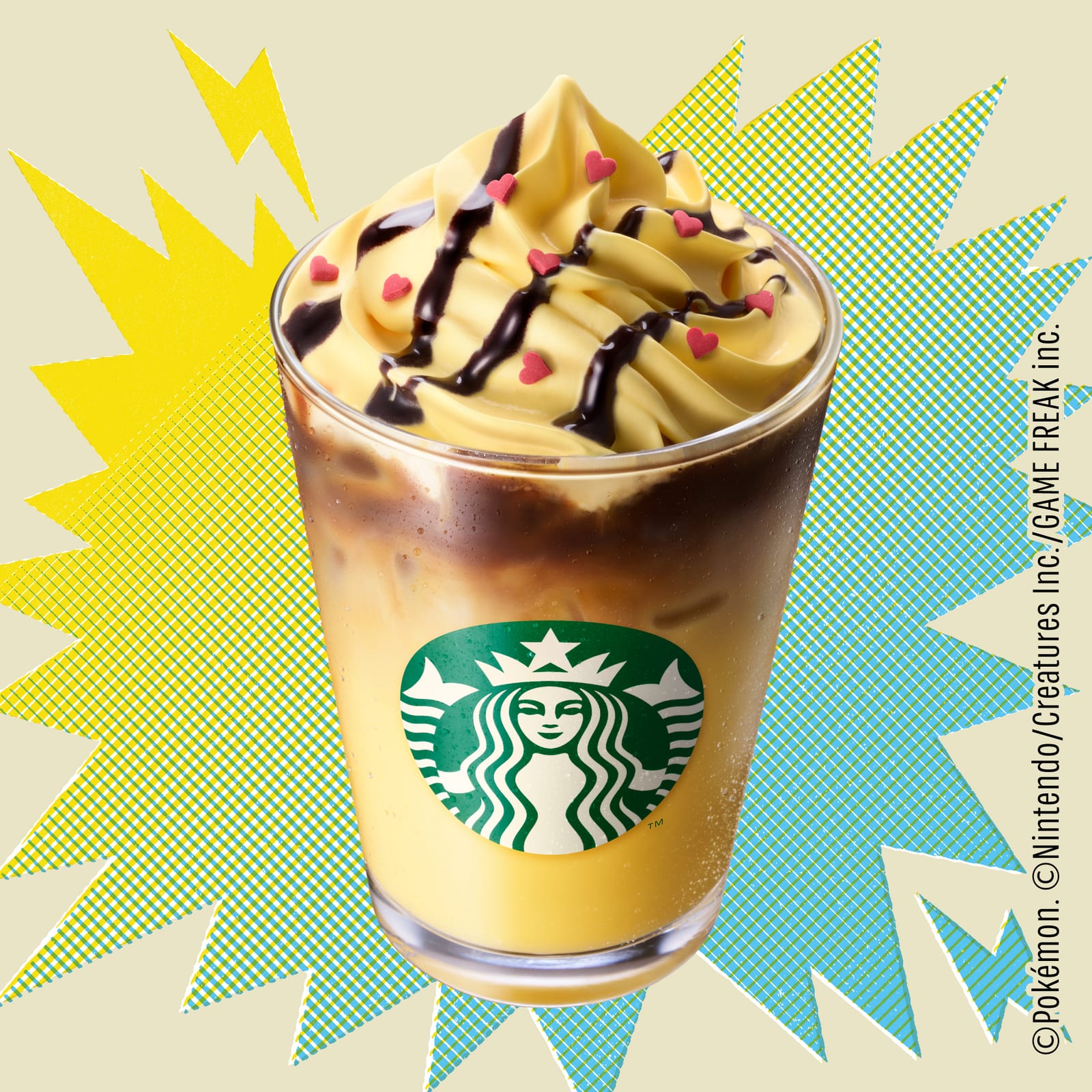The Pikachu Honey Cream Latte: an iced espresso drink in a Starbucks cup under honey-coloured whipped cream, topped with heart-shaped pieces and a coffee drizzle