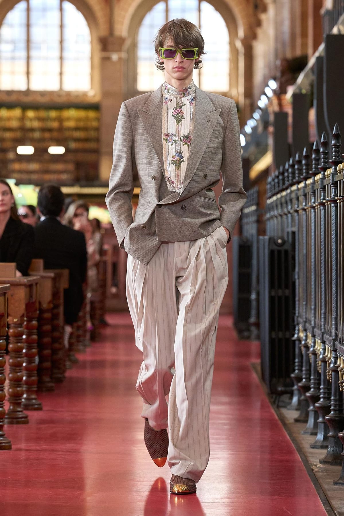 A Valentino Spring 2027 look: a grey double-breasted jacket with a patterned shirt and wide cream trousers